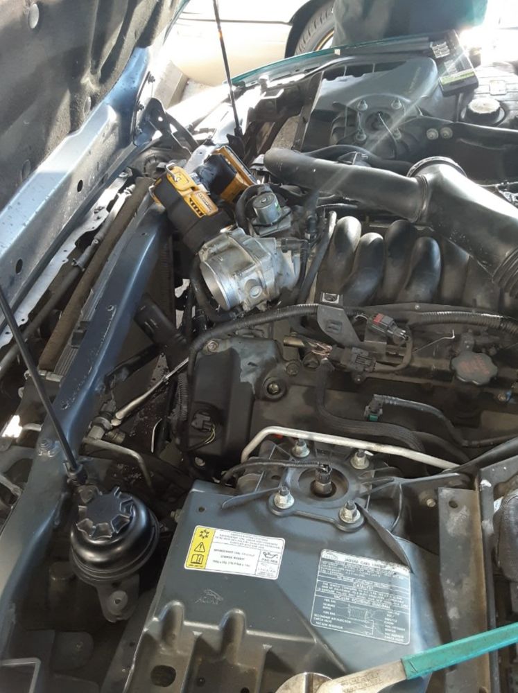 Cordless tools staged over the engine bay on a Westminster no start visit